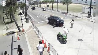 Onlookers and police band together to save motorcyclist trapped underneath car in Myrtle Beach