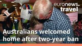 Australians in tears as travellers return home after two-year travel ban