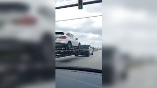 VERY Small pickup truck pulling heavy weight vehicles on trailer