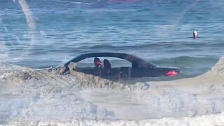 BMW washed out to sea on Cornish beach rescued by coastguard