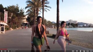 Holiday footage Women in Bikinis Crop Tops Cut-open dresses walking past